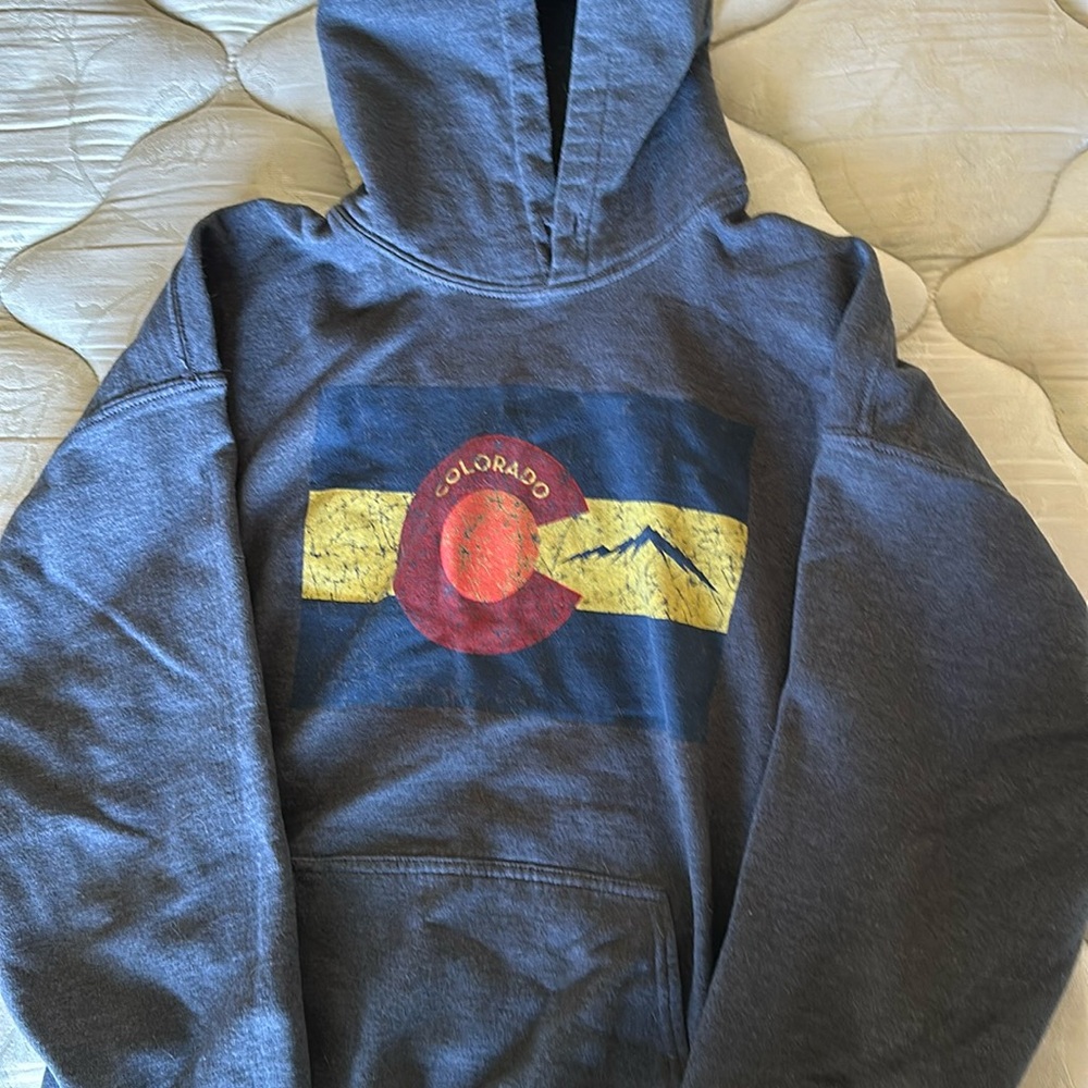 Men’s grey hoodie. Size says XL but I think it fits a little more like a L.